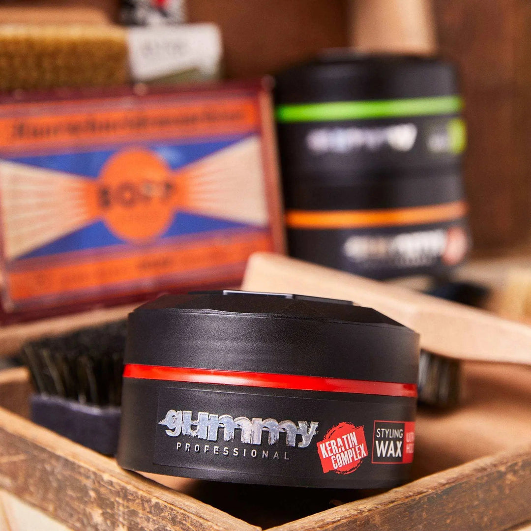 GUMMY STYLING WAX 150 ML ULTRA HOLD, watermelon scent, long-lasting strong hold hair wax in black container.